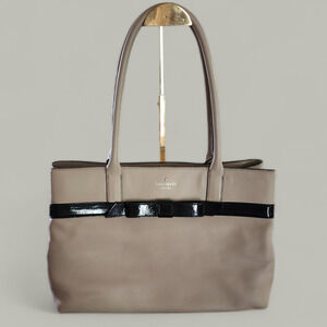 Kate Spade soft tan leather with patent leather black bow shoulder bag.